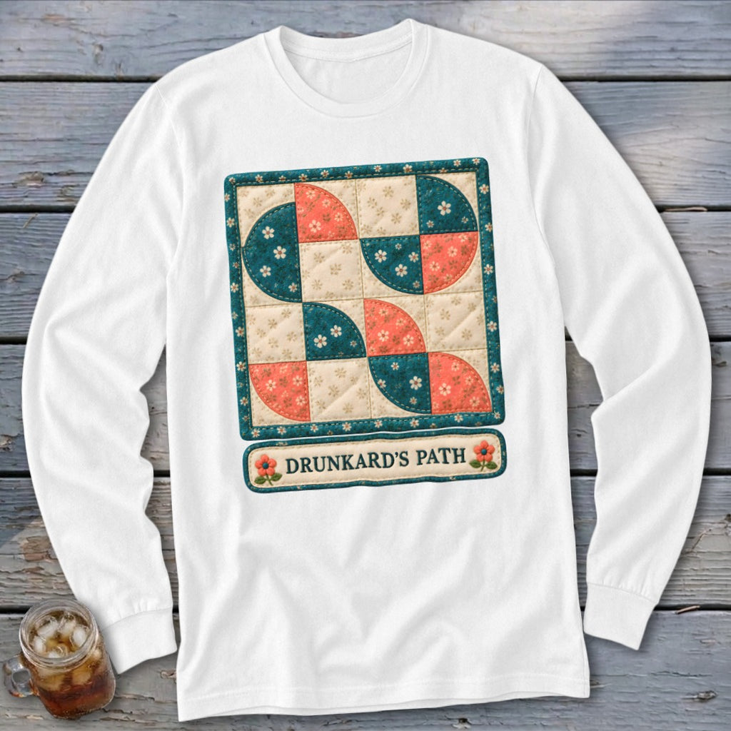White long-sleeve shirt with "Drunkard's Path" quilt design and floral accents.