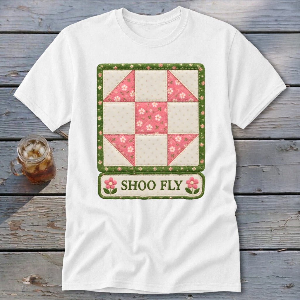 White t-shirt with a square quilt block design and "SHOO FLY" text.