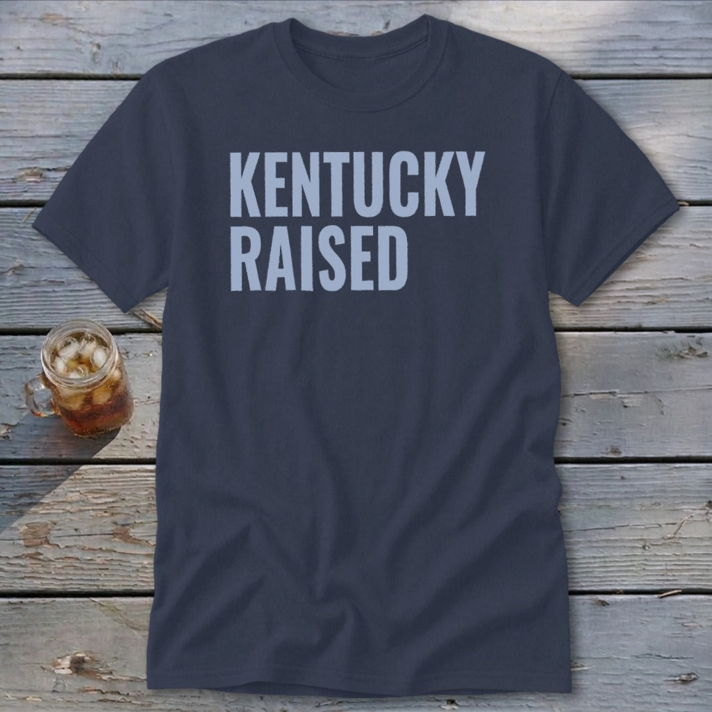 Navy blue t-shirt with "KENTUCKY RAISED" text in light blue.