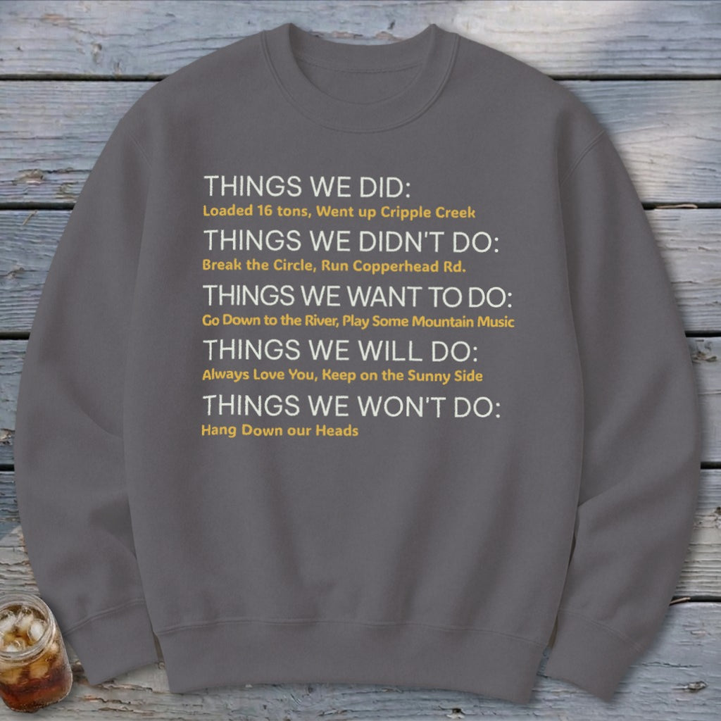 Gray sweatshirt with text listing "Things We Did," "Didn't Do," "Want to Do," "Will Do," and "Won't Do."