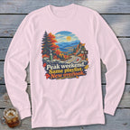 Pink long-sleeve shirt with autumn mountain landscape graphic and text.