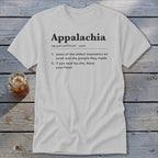 Light gray t-shirt featuring dictionary-style text defining Appalachia, laid flat on a rustic wooden surface.