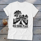 White t-shirt with graphic of a farmhouse, trees, and fence, text Old Home Place.