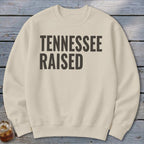 Cream crewneck sweatshirt with black text "TENNESSEE RAISED"