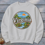 White sweatshirt with circular Virginia mountain landscape graphic featuring a deer.