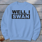 Light blue crewneck sweatshirt with the text WELL I SWAN printed in black on the chest.