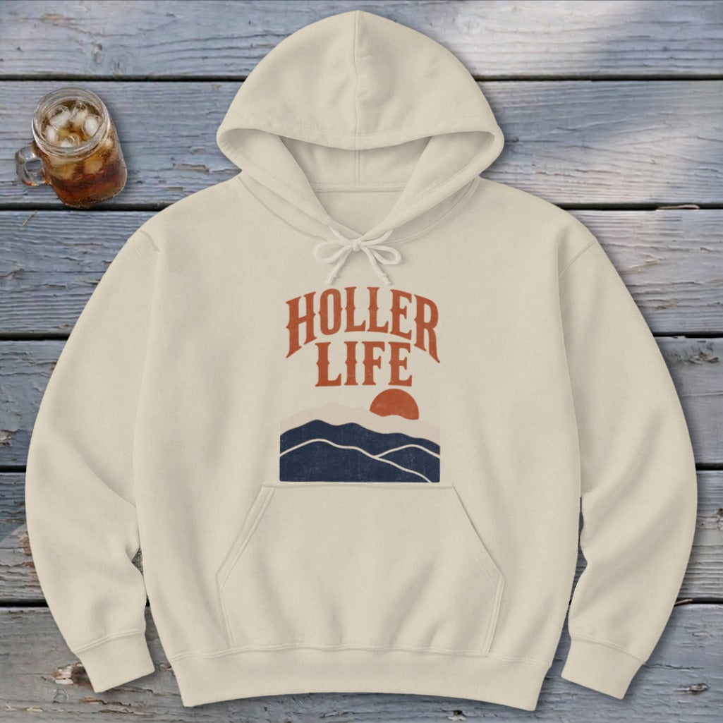 Beige hoodie featuring the text "Holler Life" above a blue mountain graphic and orange sun.