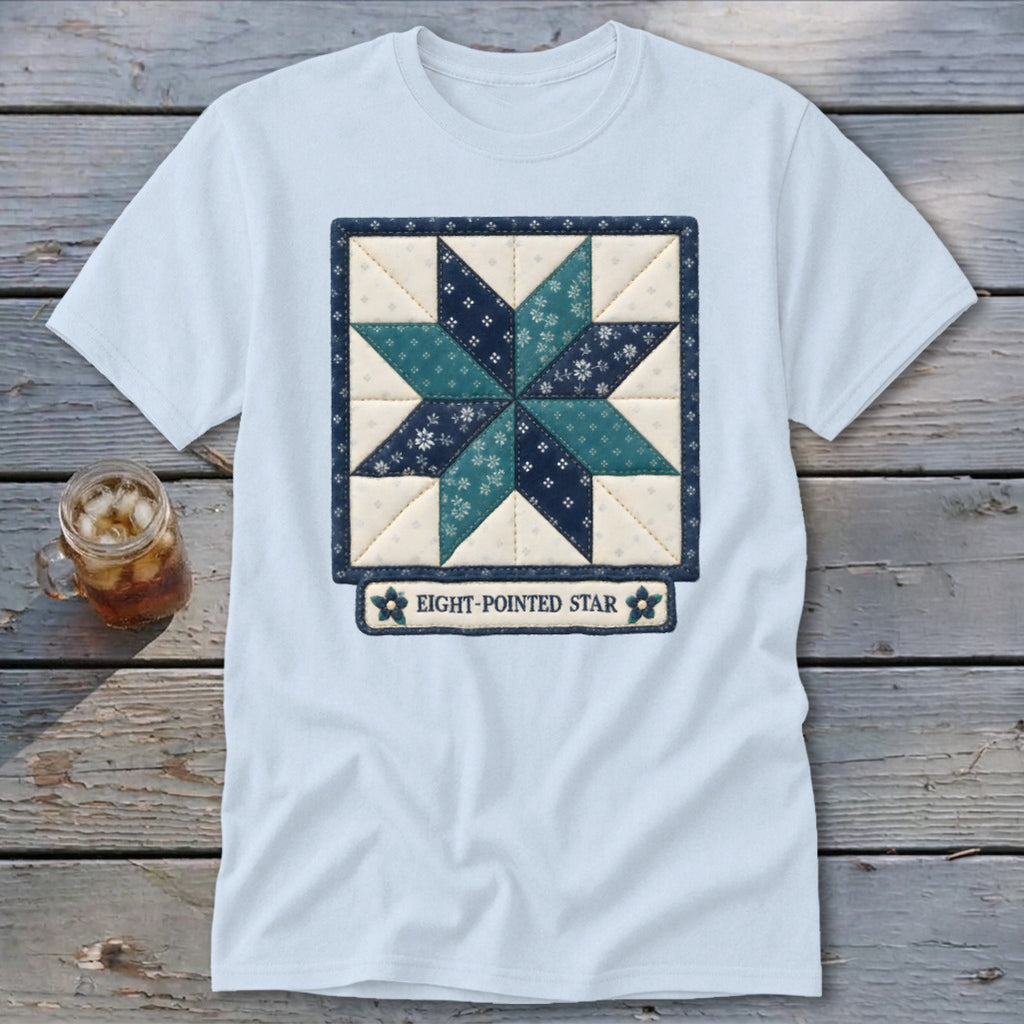 Light blue t-shirt with a quilted eight-pointed star design and text.