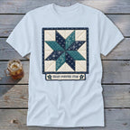 Light blue t-shirt with a quilted eight-pointed star design and text.