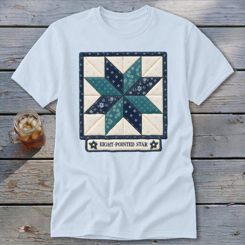 Light blue t-shirt with a quilted eight-pointed star design and text.