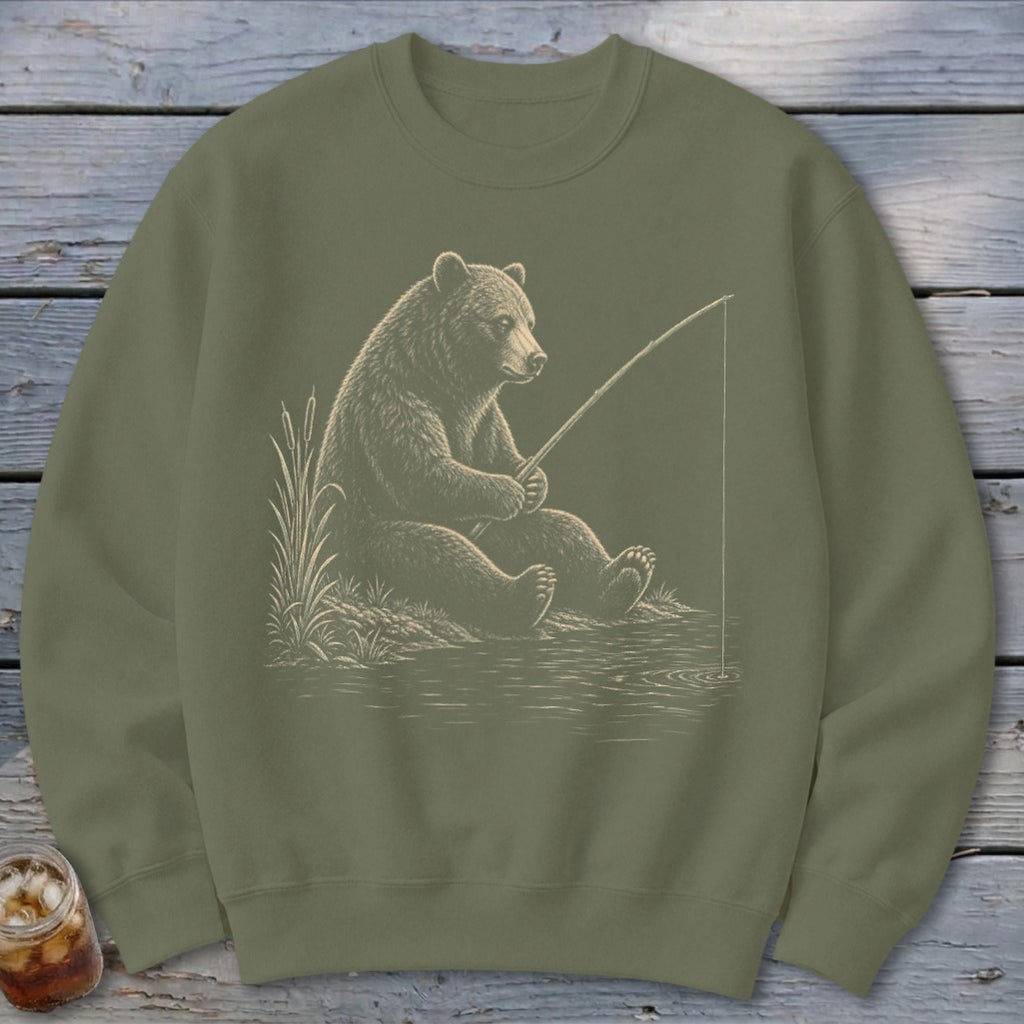 Bear sitting by the water, holding a fishing rod.