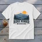 White t-shirt with "RIDGE RUNNER MORNING" text and mountain sunrise graphic.