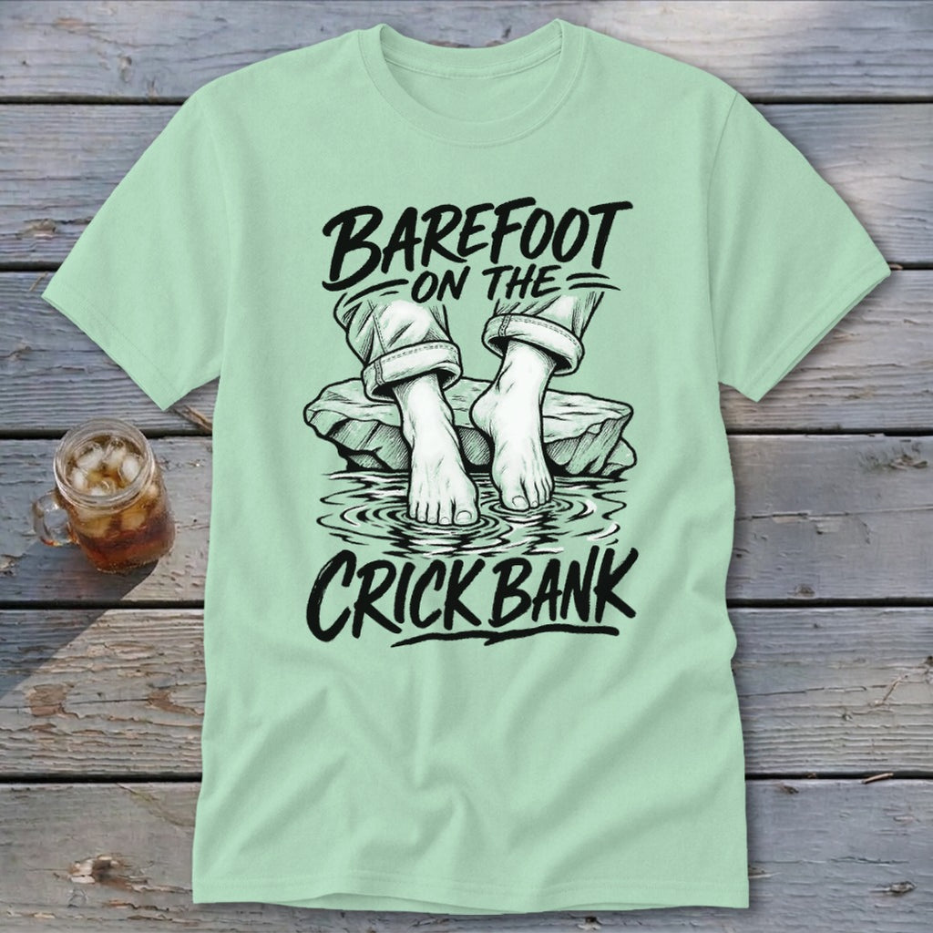 Light green t-shirt with "Barefoot on the Crick Bank" text and illustration.
