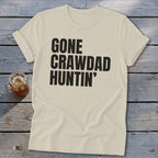 Cream t-shirt with black text that reads "GONE CRAWDAD HUNTIN'".