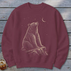Maroon sweatshirt with a detailed illustration of a bear looking at a crescent moon and stars.
