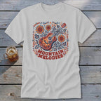 Light gray t-shirt featuring a folk art illustration of a guitar, sunflowers, and the text Mountain Melodies.