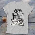 A light gray t-shirt featuring a black graphic of a wooden porch with Wi-Fi signals and text reading HOLLER WIFI? One bar, if you stand on the porch.