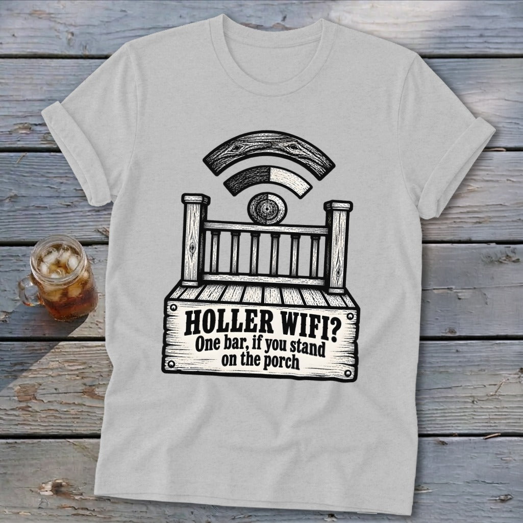 A light gray t-shirt featuring a black graphic of a wooden porch with Wi-Fi signals and text reading HOLLER WIFI? One bar, if you stand on the porch.