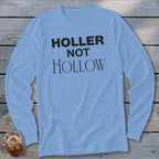 Light blue long-sleeve shirt with "HOLLER NOT HOLLOW" text in black.