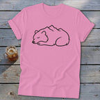 Pink t-shirt with a sleeping bear design integrated with mountains.