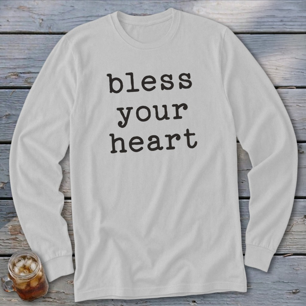White long-sleeve shirt with "bless your heart" text in black serif font.