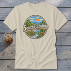 South Carolina graphic t-shirt featuring mountains, river, deer, and sunset.