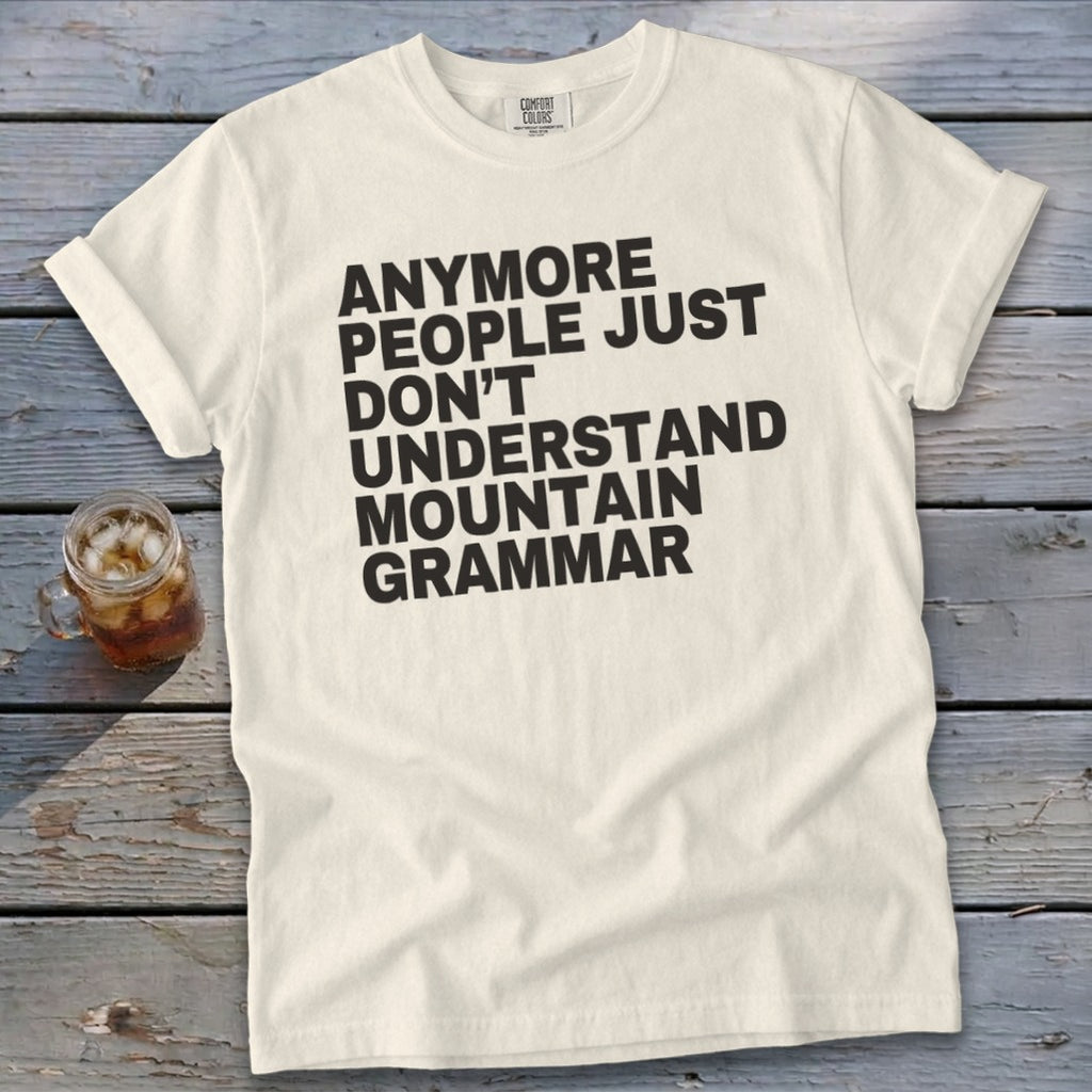 Cream t-shirt with black text "Anymore people just don't understand mountain grammar".