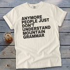 Cream t-shirt with black text "Anymore people just don't understand mountain grammar".