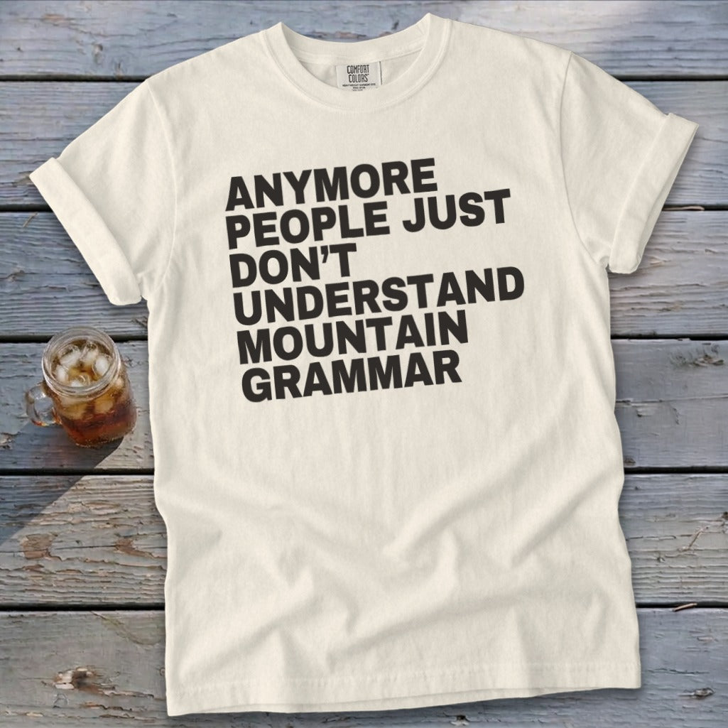 Cream t-shirt with black text "Anymore people just don't understand mountain grammar".