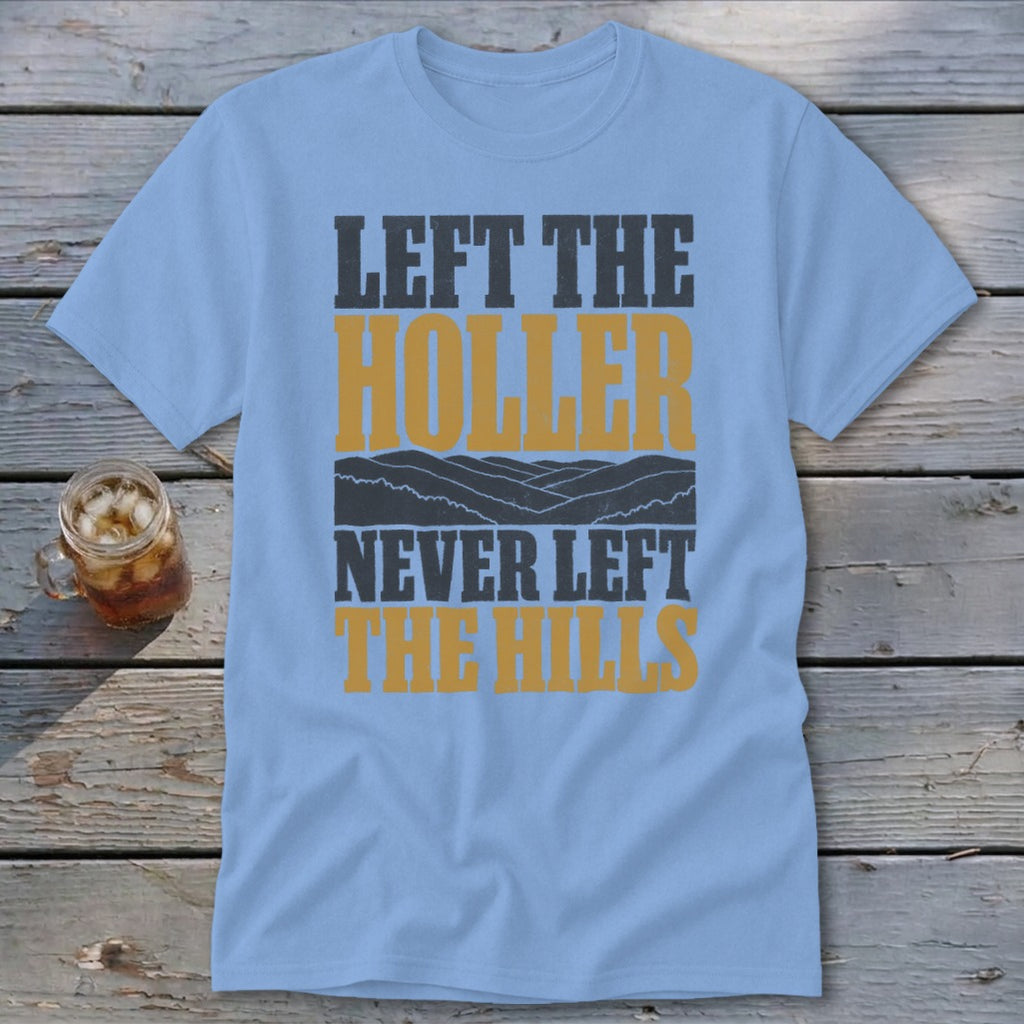 Light blue t-shirt with "LEFT THE HOLLER NEVER LEFT THE HILLS" text and mountain graphic.
