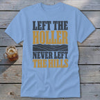 Light blue t-shirt with "LEFT THE HOLLER NEVER LEFT THE HILLS" text and mountain graphic.