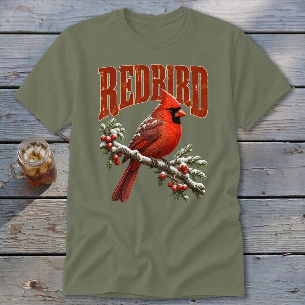Olive green crewneck t-shirt featuring a red cardinal on a snowy branch with REDBIRD text above.