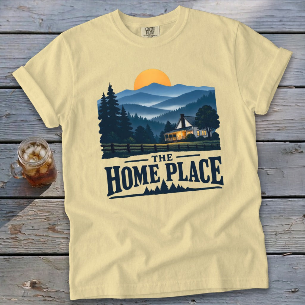 Yellow t-shirt with "The Home Place" text and mountain house graphic.