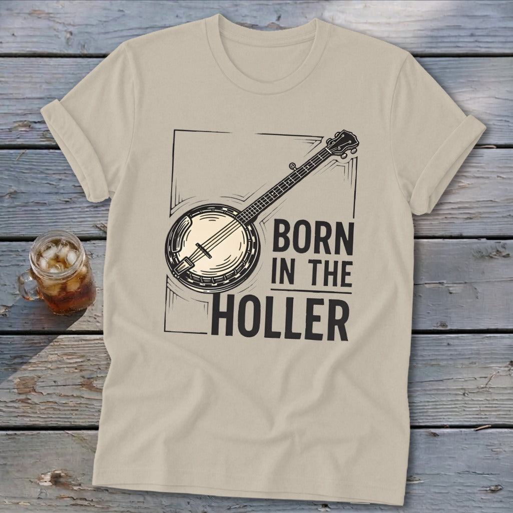 Tan t-shirt with banjo graphic and text "BORN IN THE HOLLER".