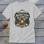 T-shirt graphic with lantern, mountains, and text "Always Leave the Light On Come On In."