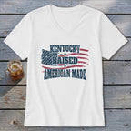 White v-neck t-shirt with distressed American flag graphic and text "Kentucky Raised American Made".