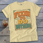Cream t-shirt with "Fixin' to do nothing" text in vintage style.