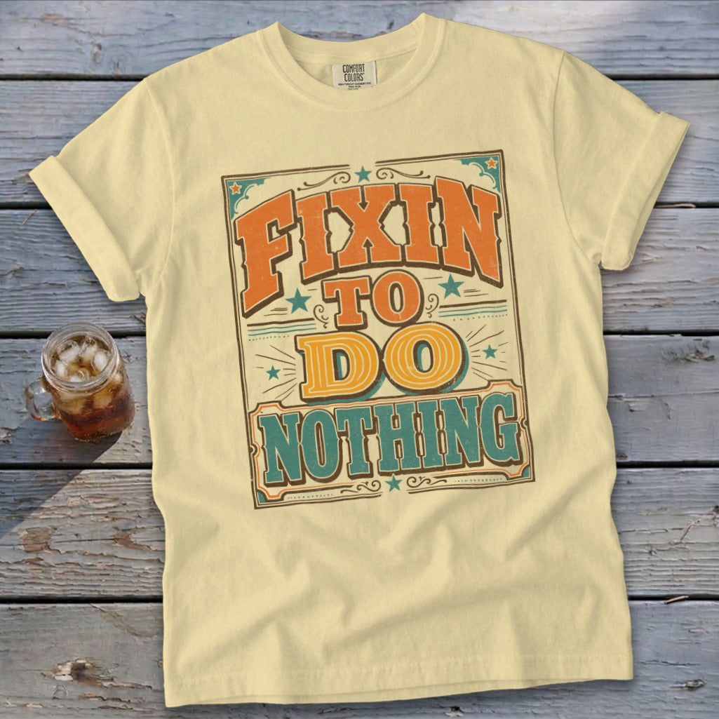 Cream t-shirt with "Fixin' to do nothing" text in vintage style.