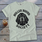 Light colored t-shirt with black "Holler Hound Society" text and dog graphic.