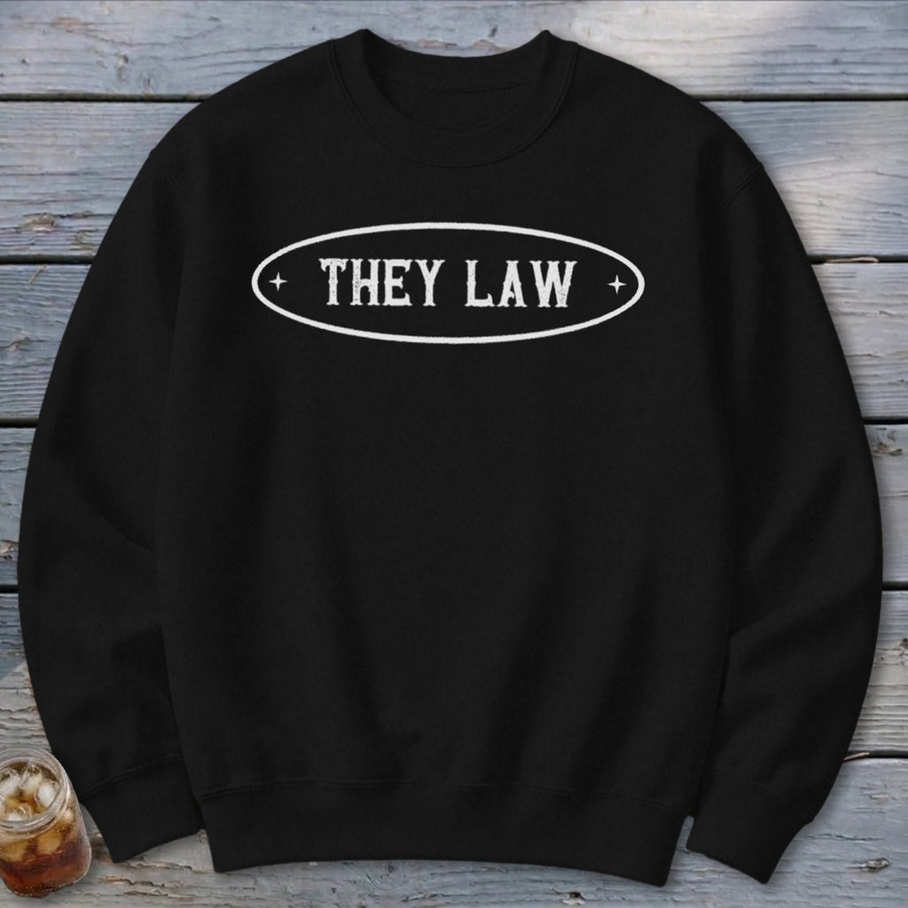 Black sweatshirt with white oval text reading "THEY LAW".