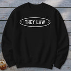 Black sweatshirt with white oval text reading "THEY LAW".