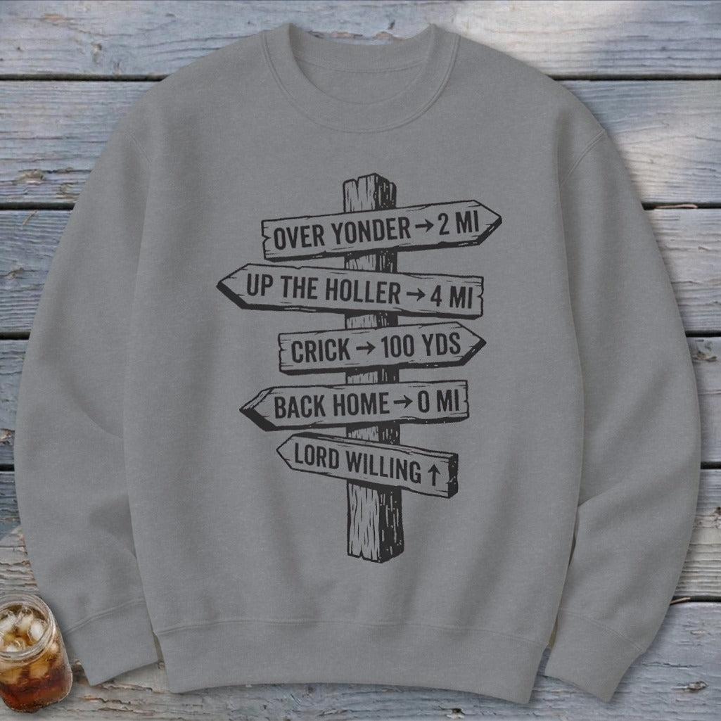 A grey crewneck sweatshirt featuring a black graphic of a wooden signpost with directional text.