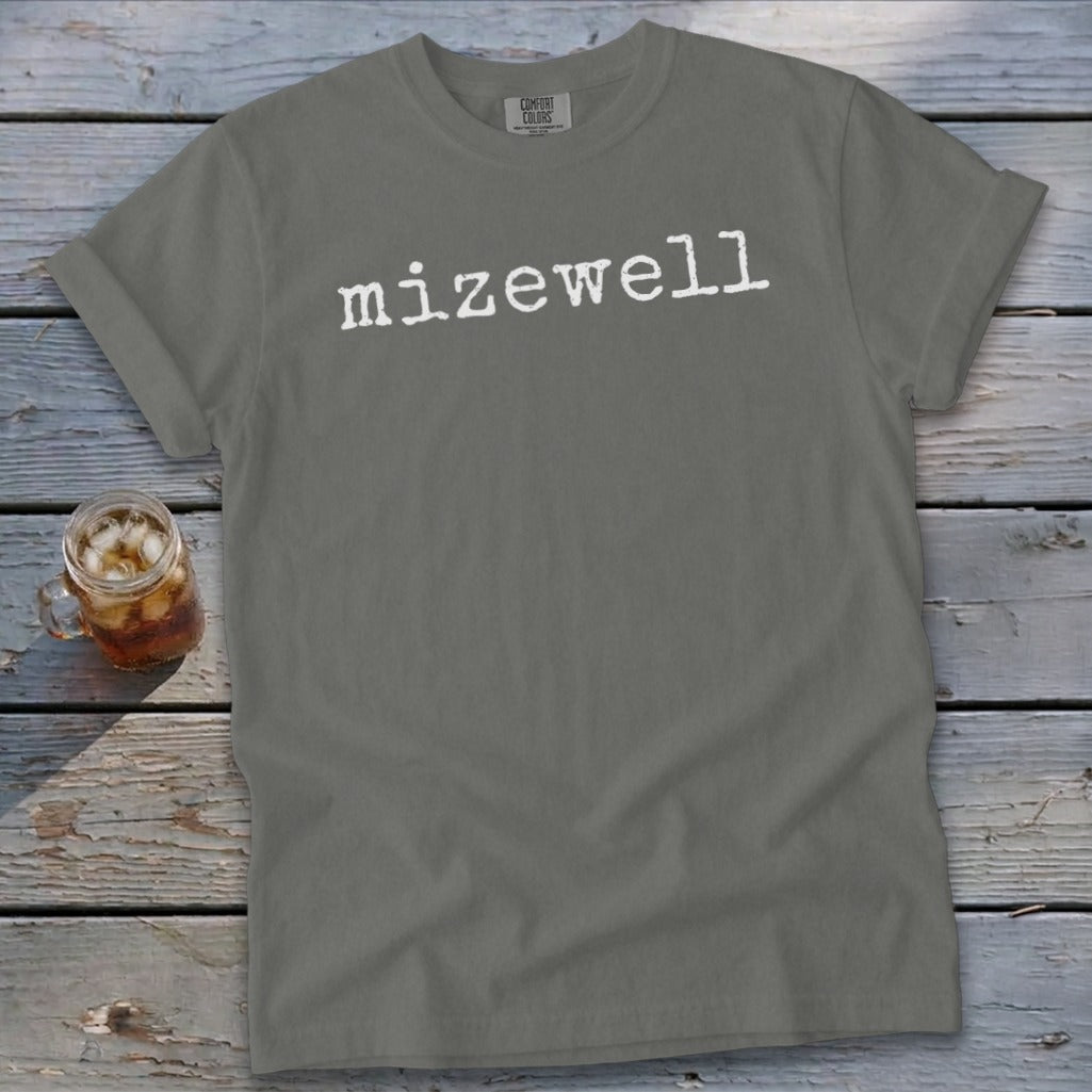 Grey t-shirt with white "mizewell" text and a glass of iced tea.
