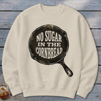 Cream sweatshirt with black text "NO SUGAR IN THE CORNBREAD" inside a skillet graphic.