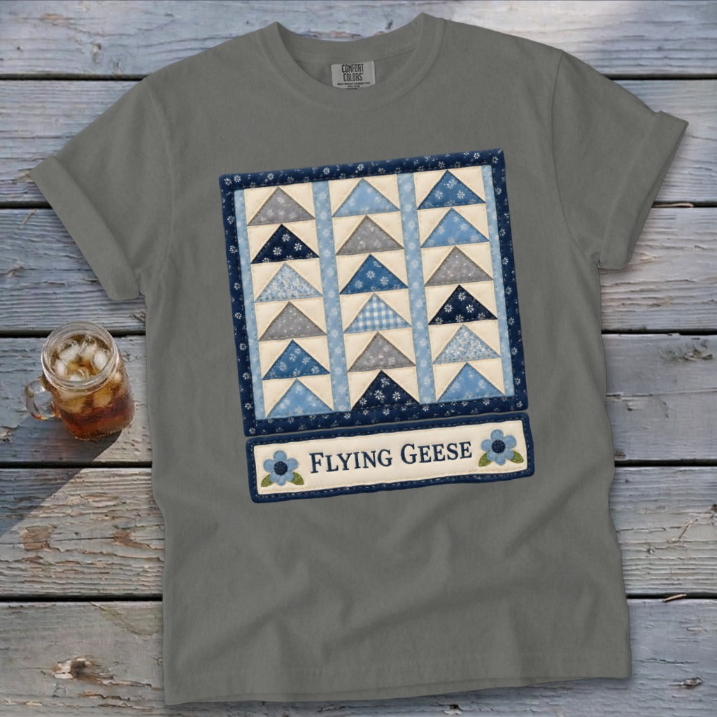 Grey t-shirt with a quilt graphic and the words "FLYING GEESE".