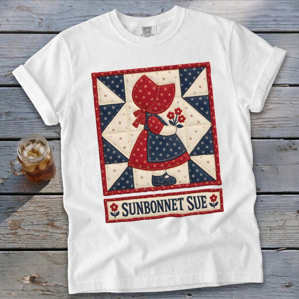 White t-shirt featuring a Sunbonnet Sue quilt block design with text.