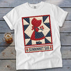 White t-shirt featuring a Sunbonnet Sue quilt block design with text.