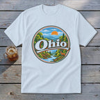 White t-shirt with a circular graphic of Ohio mountains, river, deer, and sunset.