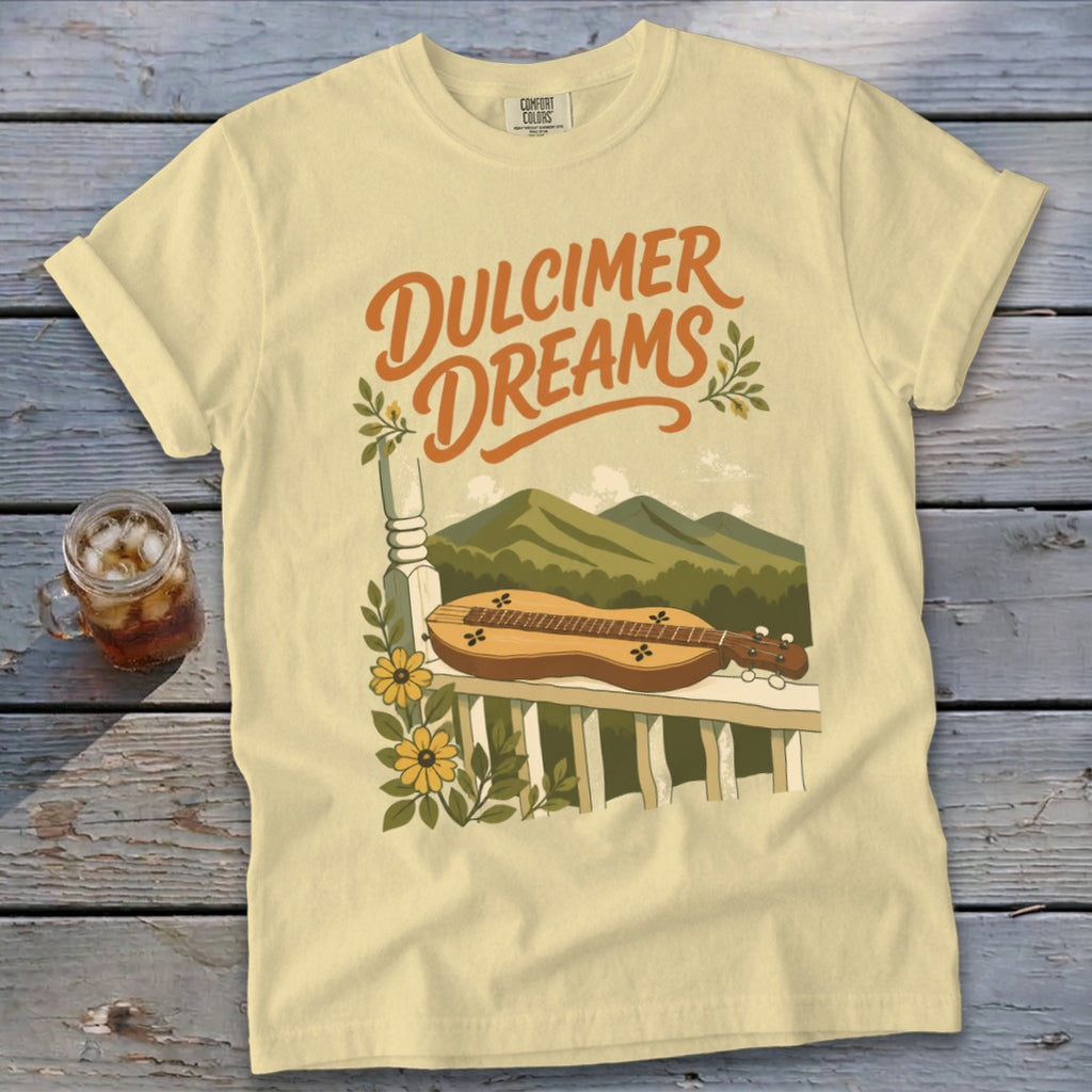Yellow t-shirt with "Dulcimer Dreams" text and mountains scene.