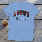 Light blue t-shirt with "LORDY MERCY" text on the front.